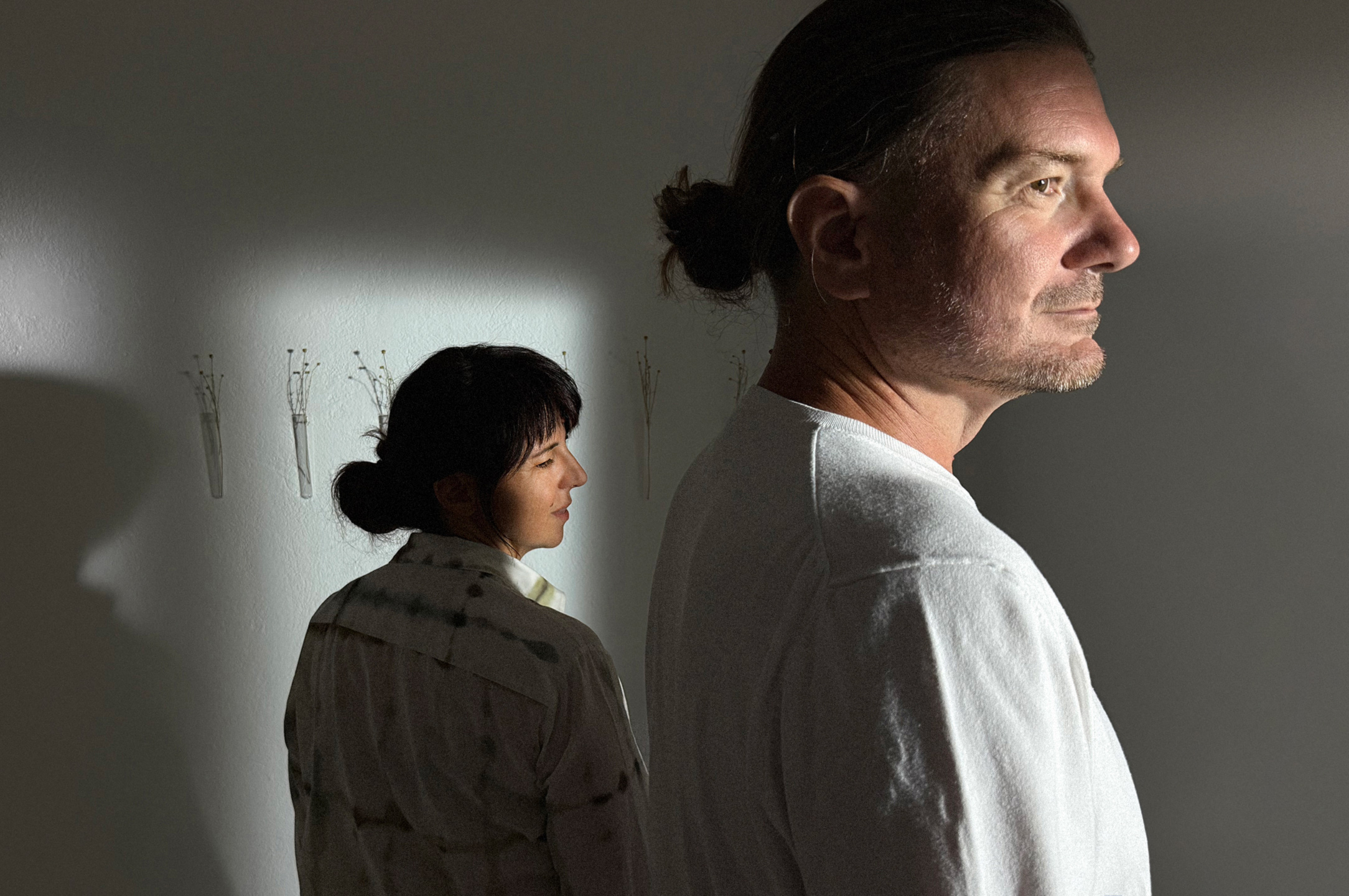 Portrait of Vesna and Vjeran in Atelier Arhe on Ciovo near Trogir, captured in artistic light and shadow, representing relaxing treatment inspired by shiatsu.